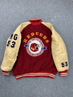 Vintage Redcubs American Football Team Sapporo University Sleeve Leather Varsity Jacket Letterman Embroidery Baseball Jumper Highschool Condition: USED. refer picture and details armpit to armpit: 26 inches from collar to the bottom: 29 inches Sleeve length : 35 inches Kindly note that the item is used! Please ensure that the size and conditions meet your requirements before purchasing. Please contact me to get more photos and details. I will reply you ASAP. payment: PayPal Shipping Worldwide. C Varsity Jacket University, Red Sports Outerwear With Letter Print, Red Letter Print Sports Outerwear, Red Cotton Outerwear With Letter Print, Hooded Embroidered College Varsity Jacket, Red Varsity Jacket With Baseball Collar For Sports Events, Hooded Embroidered Varsity Jacket For College, Red Long Sleeve Varsity Jacket With Patchwork, Red Patchwork Varsity Jacket