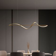 a modern dining room table with chairs and a light fixture hanging from the ceiling over it