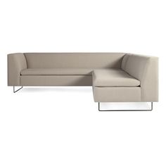 a large sectional couch sitting on top of a white floor