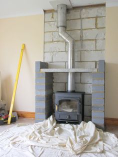 a brick fireplace being installed in a room