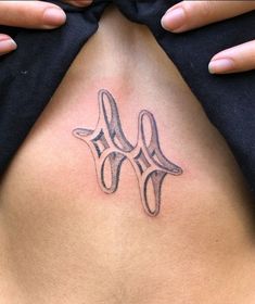 a person with a tattoo on their stomach