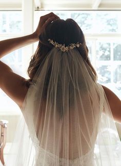 the back of a bride's head wearing a veil