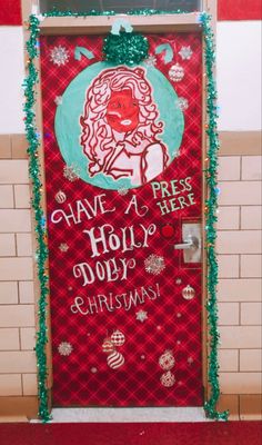 a door decorated with christmas decorations and writing on the front, says have a holly jolly christmas