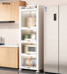 a white refrigerator freezer sitting inside of a kitchen