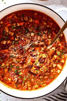 a large pot filled with pasta and meat soup