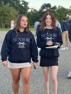 Custom Senior Sweatshirt  Sweatshirt colors:  Navy, Graphite Gray, Heathered Gray, Black, Light Pink You may pick 1 color for the word Senior and the rest will be in white (as shown) Thread Color: Red, Orange, Black, Navy, Light Pink, Light Gray, Green, Dark Gray, Black, Purple, Yellow, Lime (leave this color in the personalization box with name or in the comments box with the order.  If no color is picked I will stitch the same color as the sweatshirt) The name is also stitched on the left sleeve towards the cuff.  Please leave a SINGLE first name (this is not Lindsay Sue that is 2 names) in the Personalization box Please allow 7-14 business days to complete your sweatshirt. If you are looking for other colors, please send me a message. Free Shipping. Crew Neck Tops For College Events In Fall, Long Sleeve Sweatshirt With Text Print For School, Sporty Long Sleeve Tops For College Events, Casual Long Sleeve Sweatshirt For College Events, Casual Long Sleeve Sweatshirt For College, Casual Tops For College Events In Fall, Casual Fall Tops For College Events, School Spirit Crew Neck Sweatshirt For College Events, School Spirit Long Sleeve Sweatshirt For College Events