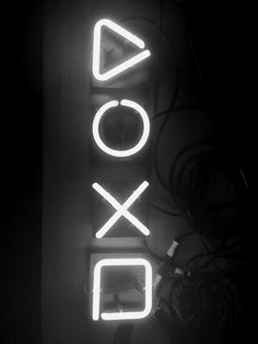 a black and white photo of a neon sign with the word xoxo on it