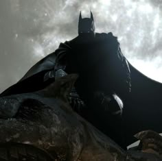 the dark knight is riding on top of a dinosaur