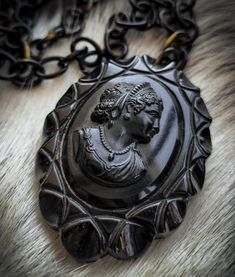 Circa 1920's bakelite, hand carved black mourning cameo necklace picturing a striking young woman's profile with a scalloped pie crust rim.  It measures 3" x 2-3/8". Female Profile, Cameo Necklace, Dream Jewelry, Pie Crust, Salt Lake City, Lake City, Necklace Etsy, 20 Cm, Hand Carved