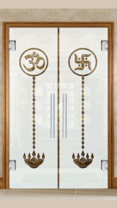 an open door with the word om shan on it and two hanging beads in front