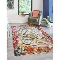 a living room with a chair and rug on the floor