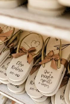 wedding favors with brown bows are on display for guests to sign in the ceremony room