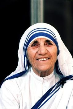 an older woman wearing a white and blue outfit