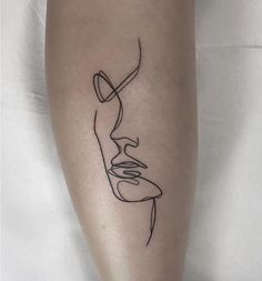 a woman's leg with a line art work on the side of her body