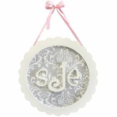 an ornament with the word sale hanging from it's side on a white background