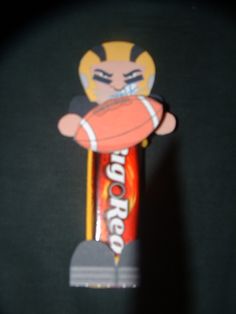 a toothbrush with an image of a tiger holding a football in it's mouth