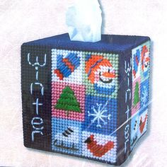 a tissue dispenser decorated with christmas decorations