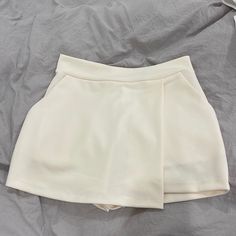 Cream Skort. New With Tags. Xs Trendy Skort With Built-in Shorts For Day Out, Trendy Short Skort With Built-in Shorts, White High-waisted Skort With Built-in Shorts, Trendy Skort With Short Inseam, Trendy High-waisted Skort With Pockets, White Mini Shorts With Pockets, Trendy High Waist Skort With Built-in Shorts, Trendy Short Length Skort For Day Out, Forever 21 High Waist Shorts For Day Out