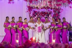 a bride and her bridal party posing for a photo