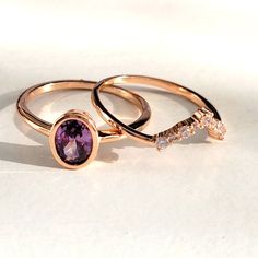 A Gorgeous Double Band Beauty Featuring An Oval Purple Crystal, Embellished By A Geometric Halo Of White Crystals. Wear This Set Together As A Show Stopping Stacker, Or Separate For More Individuality Ring Details Design: Double Band Oval Cut Purple Crystal + Round Cut White Crystals Metal: 3x Dipped 14k Rose Gold Over Hypoallergenic Brass. High Quality Plating Crystals: 5a Grade Gemandi Crystals: Unrivaled Beauty, Color, Shine & Cut Rings Rose Gold, Romantic Rings, Tanzanite Diamond Ring, Two Rings, Pink Tourmaline Ring, Tanzanite Diamond, Pave Diamond Ring, Pattern Ring, White Crystals