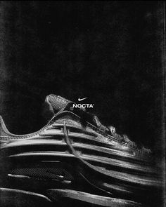 a black and white photo of a shoe with the word notta written on it