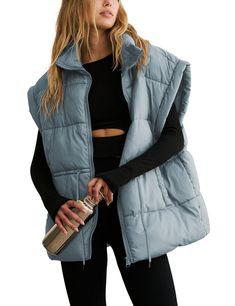 PRICES MAY VARY. Material: classic versatile puffy vest for women, lightweight warm black sleeveless padded gilet, made of soft, skin-friendly high quality polyester fabric, comfy to wear, keeping you warm during chilly days Features: womens full zip thick quality padded vest, adjustable drawstring waistband, stand collar, two side pockets, slight exaggerated shoulders, solid color, oversized style with a slouchy fit, stylish basic sleeveless padded coat allows most types of bodyshape Matching: Oversized Puffer Vest, Winter Puffer Vest, Oversized Puffer Jacket, Oversized Puffer, Padded Gilet, Fall Vest, Vest For Women, Womens Puffer Vest, Quilted Puffer Vest