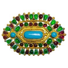 Rare Item - Chanel Vintage Gripoix Mughal Brooch Antique gold open work patterned brooch embellished with multicoloured glass cabochons. Detailed with Chanel's signature chain inspired details and turquoise placed in the centre. Featuring hook claps closure to rear. Having a hook to the rear of the brooch, giving you the option to wear it as a pendant. From Fall 1993 Collection. Size – 8cm x 5.5cm Condition – Vintage - Good/Very Good ( One glass cabochon has some damage) Composition – Metal, Gla Chanel Vintage, A Hook, Vintage Chanel, Vintage Brooches, Antique Gold, Metallica, Chanel, Turquoise, Chain