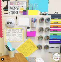 a bulletin board with magnets, paper clips and other office supplies on it's wall