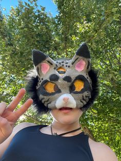 Are you a Therian with a Lynx theriotype, or just someone who really loves cats? Then this floofy mask's for YOU! Hand-crafted by a 13 year-old with a passion for crafting and an eye for detail (they are a beginner, but oh WOW are they talented).  This premium fleece-lined (inside AND out!) one-of-a-kind Therian mask will have you feeling confident (and super comfy) on two paws or all four. The third makes this mask even more unique! Need to practice quads? No problem! This mask has premium elastic -- so go ahead: walk, trot, canter, and sprint your Therian heart out! Cat Ears Masks With Whiskers For Masquerade, Masquerade Cat Ears Mask With Whiskers, Halloween Cosplay Cat Design Mask, Cat Design Costume Eye Mask, Cat Design Eye Mask For Costume, Costume Cat Design Eye Mask, Halloween Cat Design Masks And Prosthetics With Cat Ears, Halloween Cat Ears Mask With Whiskers, Halloween Cat Design Masks With Cat Ears