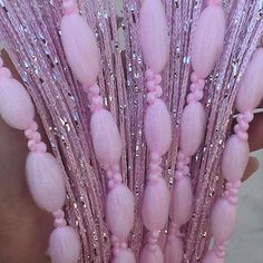 a bunch of pink flowers sitting on top of a table