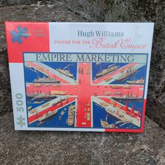 a puzzle box with an image of the british flag and ships on it's side