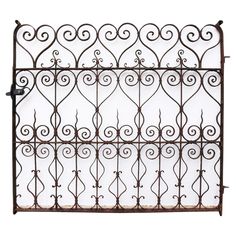 an old iron fence with scroll designs on the top and bottom, isolated against a white background