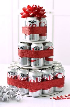 a stack of cans with red bows on top