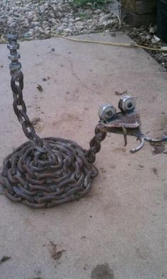 a chain that has been chained to the ground and is attached to a metal object