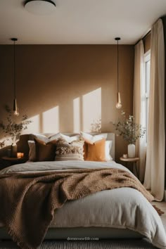 a large bed sitting in a bedroom next to a window with lots of light coming through it