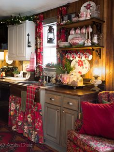 the kitchen is decorated for christmas with festive decor