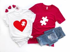 two t - shirts with hearts and keys on them, one is red and the other is white