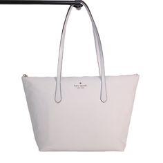 This Kitt Large Tote From Kate Spade Is The Perfect Every Day Tote For Carrying Everything You Need To Get You Through The Day. It Also Makes A Wonderful Travel Companion In This Silver Platinum Carry-On. *Size: 11"H X 12"W (Bottom) 17.6"W (Top) X 5"D *Handle Drop: 11" *Material: Nylon Exterior And Interior Lining *Metal Pinmount Logo *Zip Top Closure With Silver Zipper *Two Way Spade Jacquard Lining In Light Grey *Interior: 1 Zip Pocket And 2 Slip Pockets *New With Tags White Kate Spade Bag With Zipper Closure, Kate Spade Silver Bag, Elegant Silver Kate Spade Bag, Kate Spade Silver Bag For Everyday Use, Kate Spade Silver Bag For Everyday, Kate Spade Silver Everyday Bag, Silver Kate Spade Bag For Everyday, Kate Spade Luxury Silver Bag, Luxury Silver Kate Spade Bag