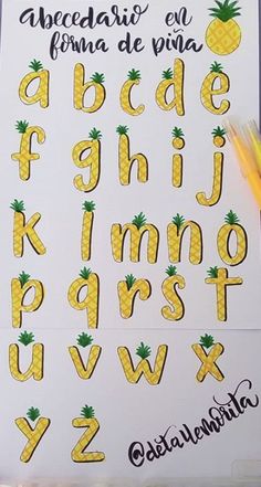 the letters and numbers are made up of pineapples, which have been drawn on paper