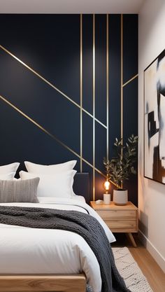 a bedroom with black walls and white bedding