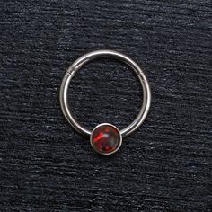 "Titanium septum clicker ring. This listing is for a single item. ITEM MEASUREMENTS: Available gauges (thickness of wire): 18g, 16g, 14g Available inner diameters: 8mm, 10mm, 12mm Gemstone size: 3mm MATERIALS USED: We create this jewelry using highest quality implant grade 23 Titanium (ASTM F-136) - best choice for people with sensitive skin. However, pure titanium version can be made upon request. SHIPPING & HANDLING: We will pack your jewelry with great care. It will come in a small and ve Round Septum Ring Gift, Spiritual Round Septum Ring Gift, Black Septum Ring Gift, Opal Septum Ring, Septum Piercing Jewelry Bm25.com, Daith Rings, Opal Septum, Septum Hoop, Daith Jewelry