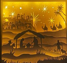 an illuminated nativity scene with the birth of jesus and three wise men in silhouette