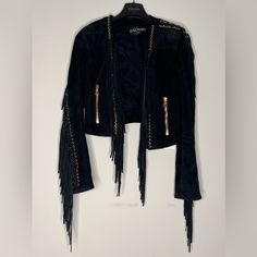 Balmain Cropped Fringe Trim Suede Moto Jacket In Black Lambskin. Gold-Tone Metal Eyelets Embellishment. Made In Turkey. Size: Fr 34 100% Lambskin. Condition: Very Good. Details: Lightly Used With Minor Signs Of Use And Marks At Trim. Luxury Long Sleeve Leather Jacket For Party, Luxury Biker Jacket For Party, Luxury Long Sleeve Biker Jacket For Party, Designer Leather Jacket For Party, Designer Leather Jacket For Night Out, Designer Long Sleeve Leather Jacket For Night Out, Designer Long Sleeve Leather Jacket For Parties, Elegant Long Sleeve Biker Jacket For Evening, Luxury Biker Jacket For Fall Parties