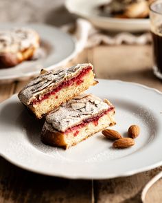 two pieces of cake sitting on top of a white plate