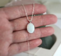 "Beautiful Large white lab-created opal pendant necklace. These gorgeous opals are very similar to natural mined opals. Lab-created opals contain 70-90% silica (from which natural opal is formed) and 10-30% resin. The resin makes the opal harder, stronger, unlike natural opals, which are known to be soft and fragile. Each opal displays a rainbow of color that sparkles with every catch of light. I've handset two different size opals in a solid sterling silver prong settings 16x12mm (5/8\" x 1/2\" White Opal Birthstone Jewelry, Elegant White Pink Opal Jewelry, Ethiopian Opal Oval Pendant Jewelry Gift, Oval Opal Jewelry With Natural Stones, White Oval Opal Necklace, White Ethiopian Opal Gemstone Jewelry, White Opal Round Pendant Necklace, Opal Round Pendant Jewelry Gift, Opal Round Pendant Jewelry For Gifts