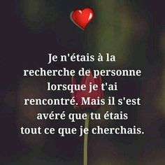 a red flower with a heart on it and the words in french are written below