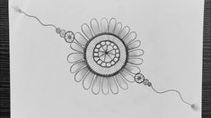 a pencil drawing of a flower with beads on it's end and a string in the middle