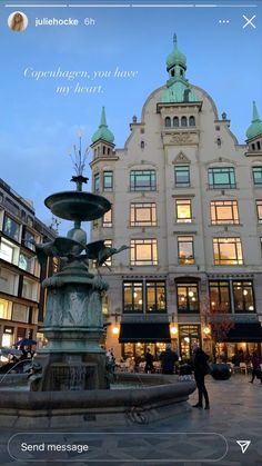 an image of a fountain in front of a building