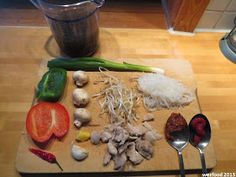 a cutting board topped with different types of vegetables