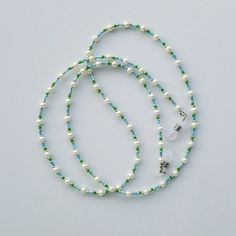 This cute and gentle eyeglass chain will make a wonderful addition to your outfit at any occasion - everyday, at work, or at party.    Weight: 0.4 oz Length: 30 inch / 76 cm Materials:  - Glass pearl white beads size 3 mm - Seed beads light blue and green color - Silver color seed beads  - Professional flexible wire - Clear color synthetic rubber loop ends with stainless steel findings ♥ I'll be happy to answer any questions you may have. If it is a gift, little gift bag or box is available. Ple Glasses Chains, Eyeglass Holder, Eyeglass Chain, Glasses Chain, Eye Wear Glasses, Synthetic Rubber, White Beads, Grandma Gifts, Blue And Green